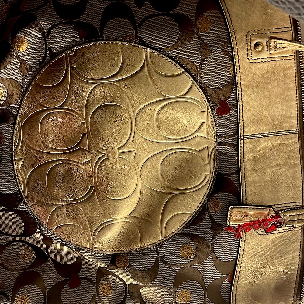 Beautiful auth Coach purse/ original card. Brown, Gold & splash of red hearts.